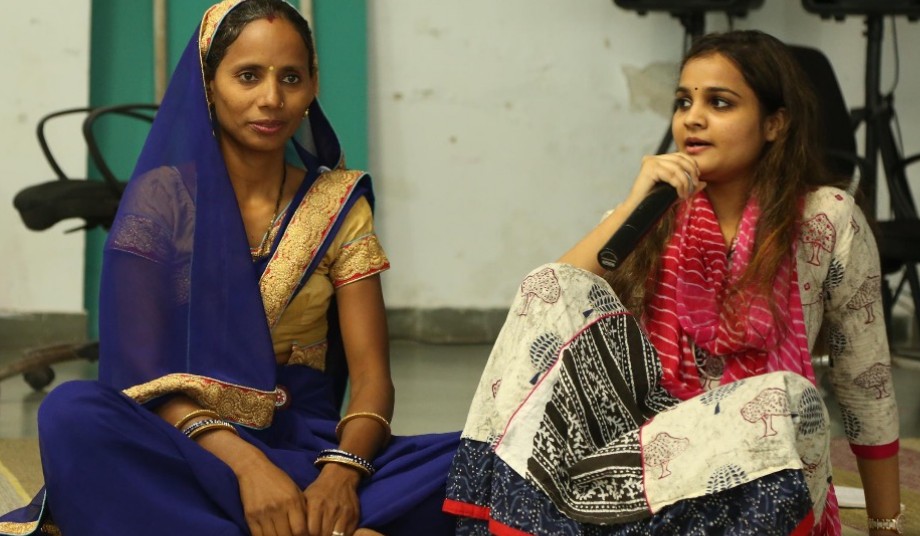 Two women sitting and discussing