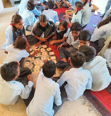 Students playing santulit bhojan game